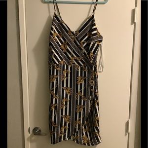 Stripped black and white dress with gold design size 2X
Never worn
